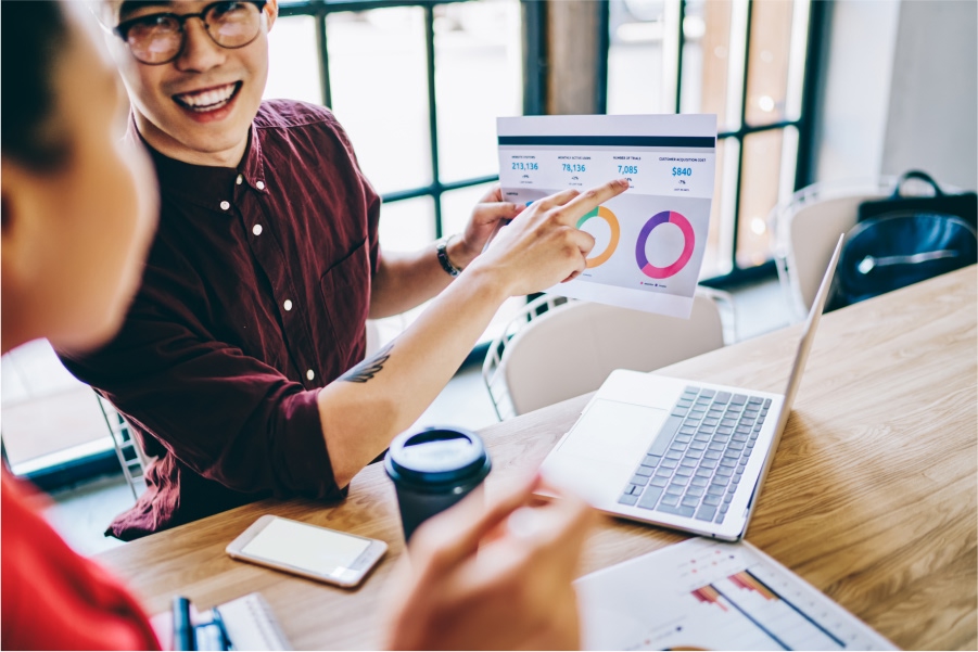 Coworkers-Checking-Seo-Ranking Seo vs paid ads roi comparison for small businesses