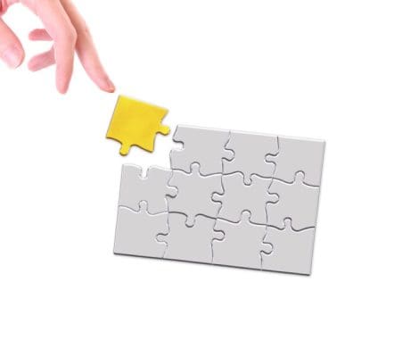Gold puzzle and hand 768x654 1