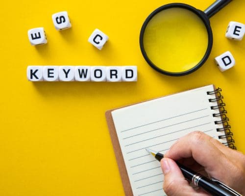 Dices with letters, symbolizing the concept of keyword research and analysis in digital marketing