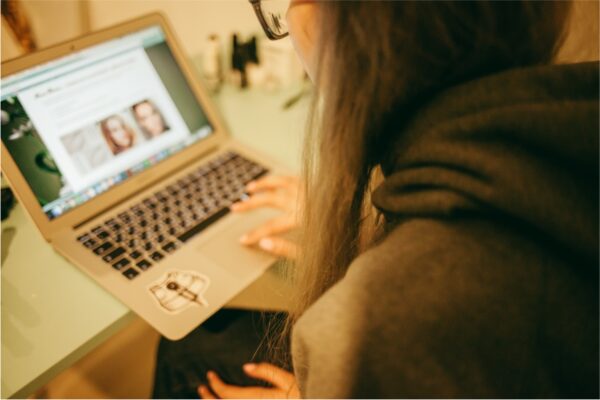 Woman searching content on laptop
